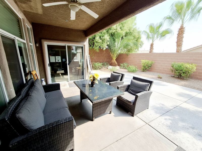 Covered patio with comfortable outdoor seating